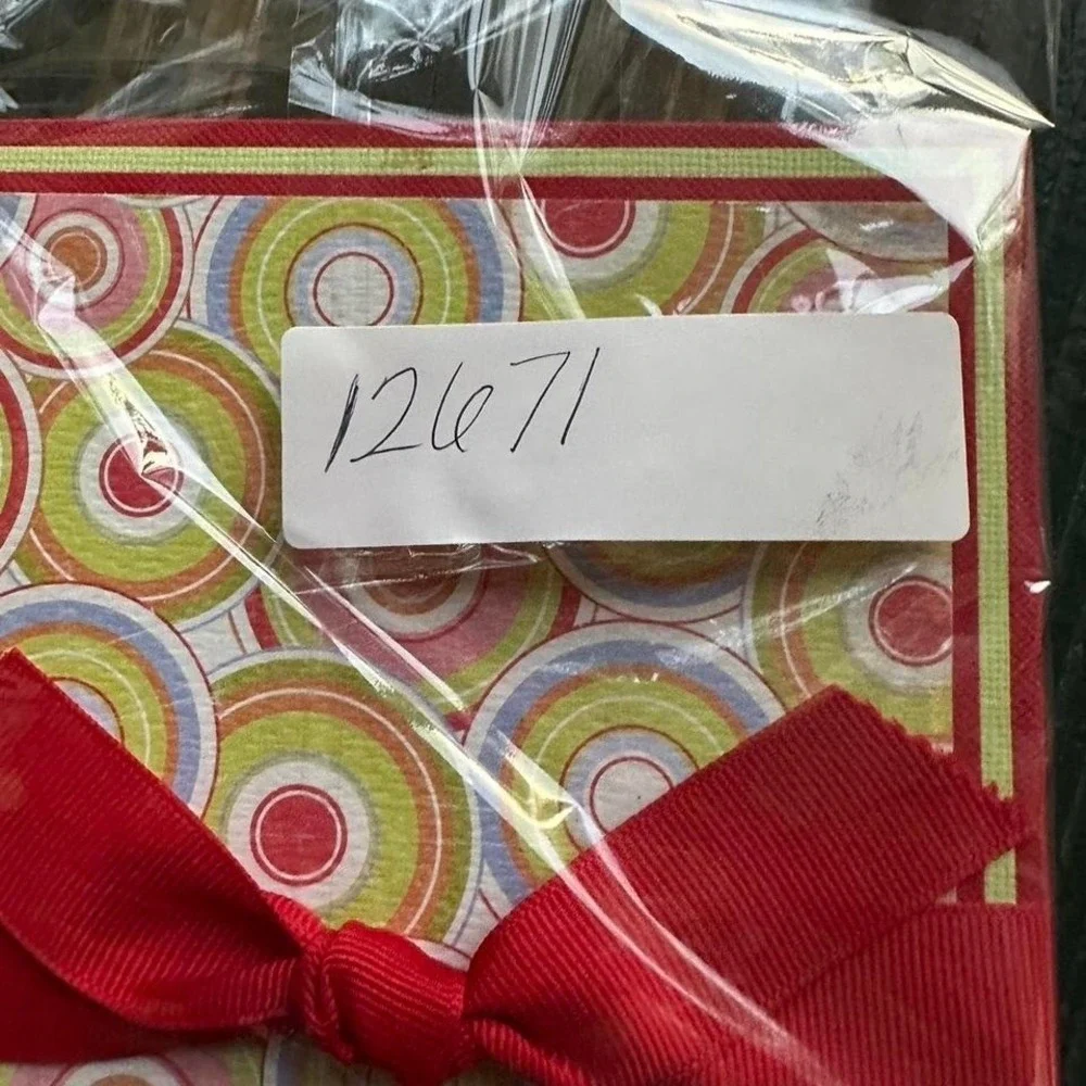 Red and yellow spiral website address book with ribbon